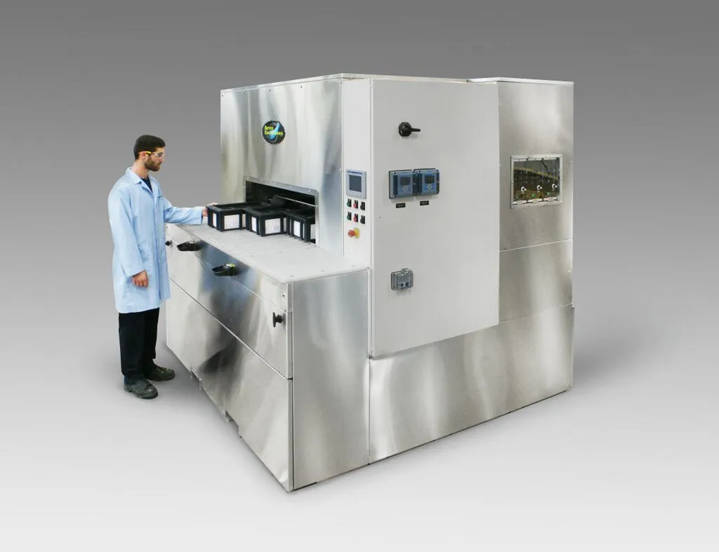 Rotary Drum Washer designed for cleaning intricate plates that had been laser drilled.