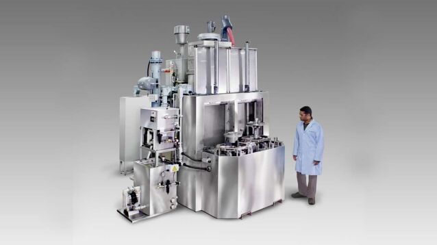 Dual vertical door parts washer for robotic work cell