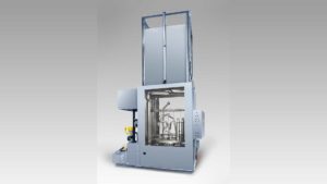 Powered vertical door turntable washer to clean exhaust pipes tubes