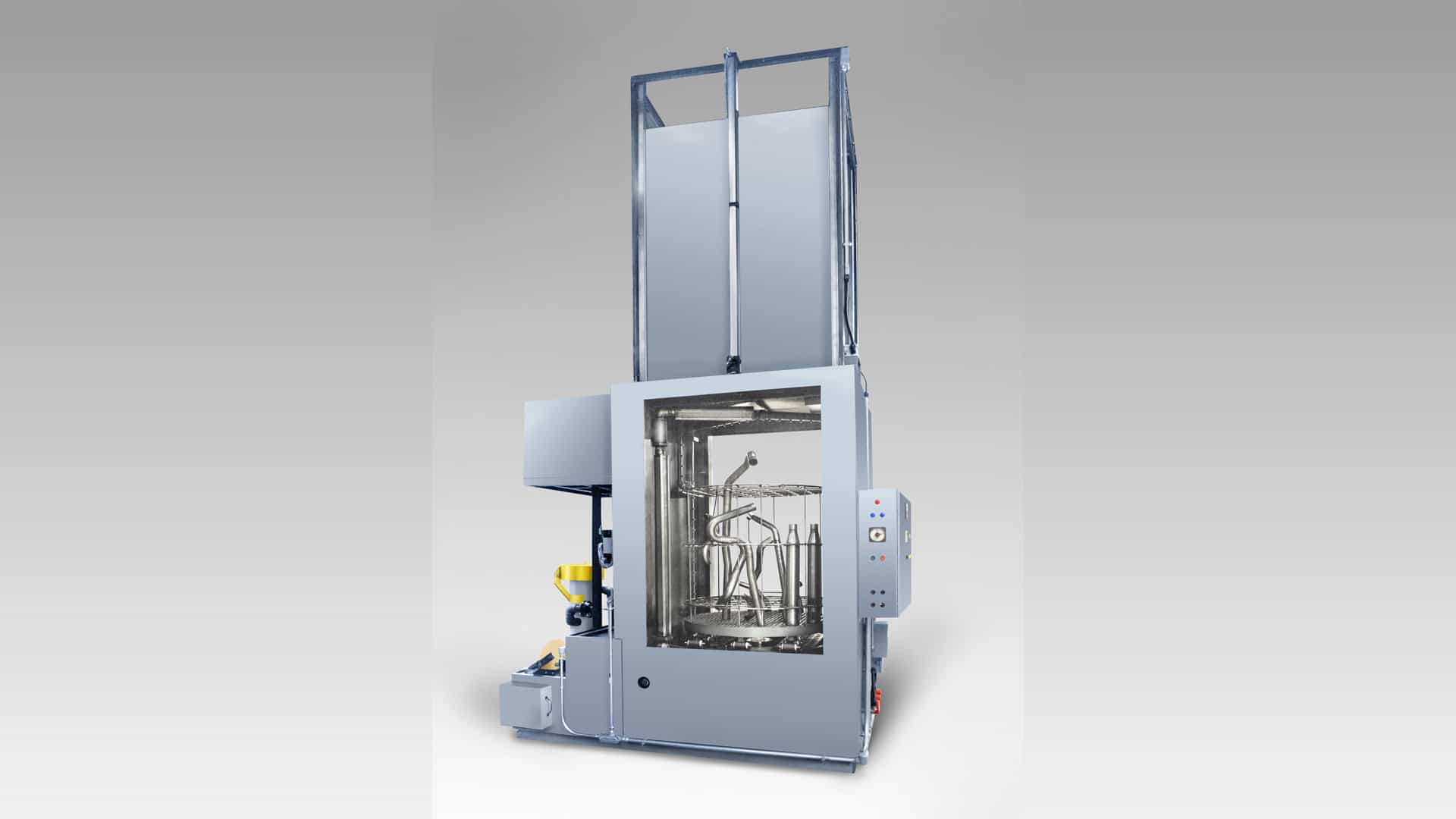 Powered vertical door turntable washer to clean exhaust pipes tubes