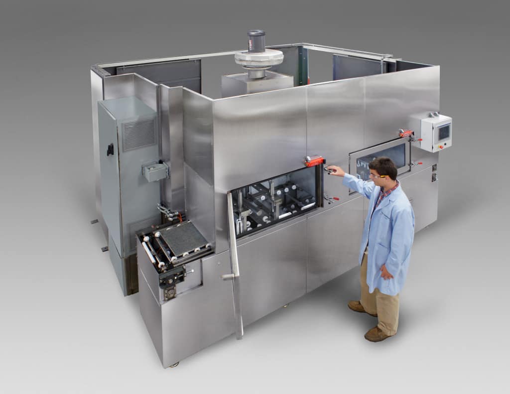 High pressure conveyor belt washer for cleaning dental mold trays