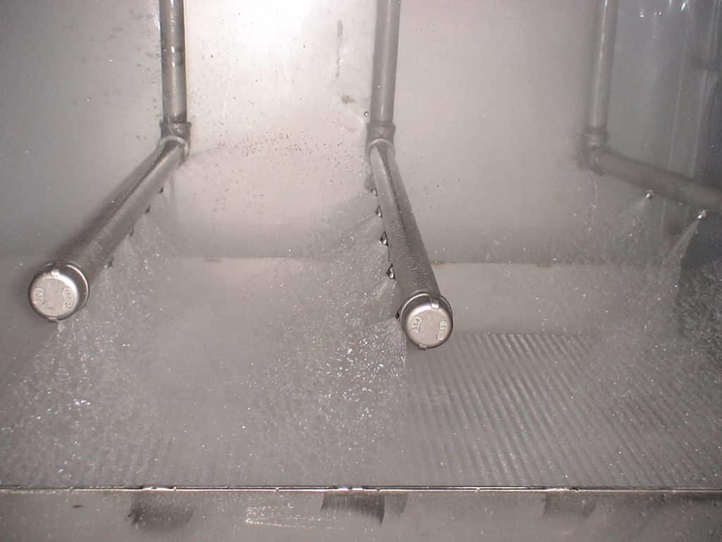 Spray immersion washing
