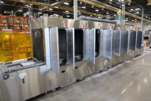 Better Engineering conveyor part washer with phosphating was system and automated chemical regulation.