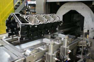 Engine block being cleaned in better engineering engine block part washer.
