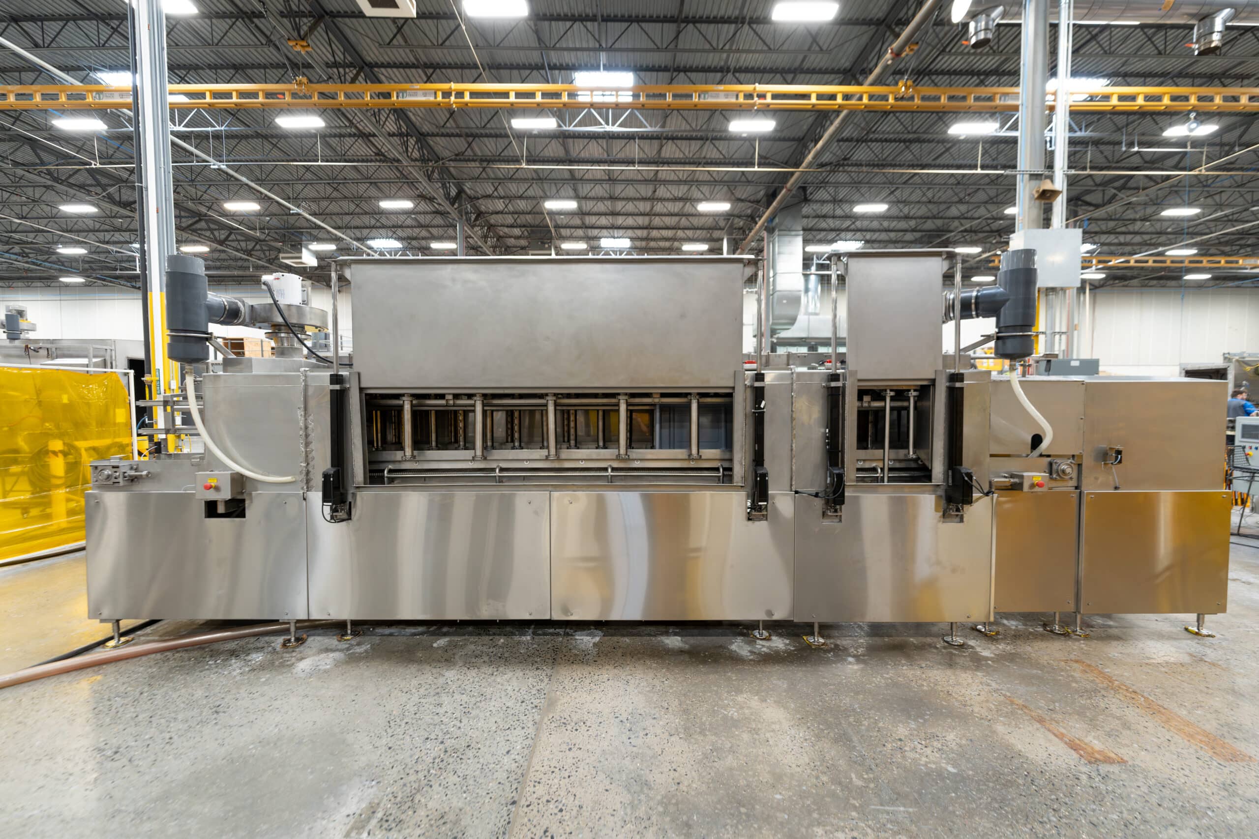 Better Engineering food industry part washer. Stainless steel construction, dual-lane conveyor.