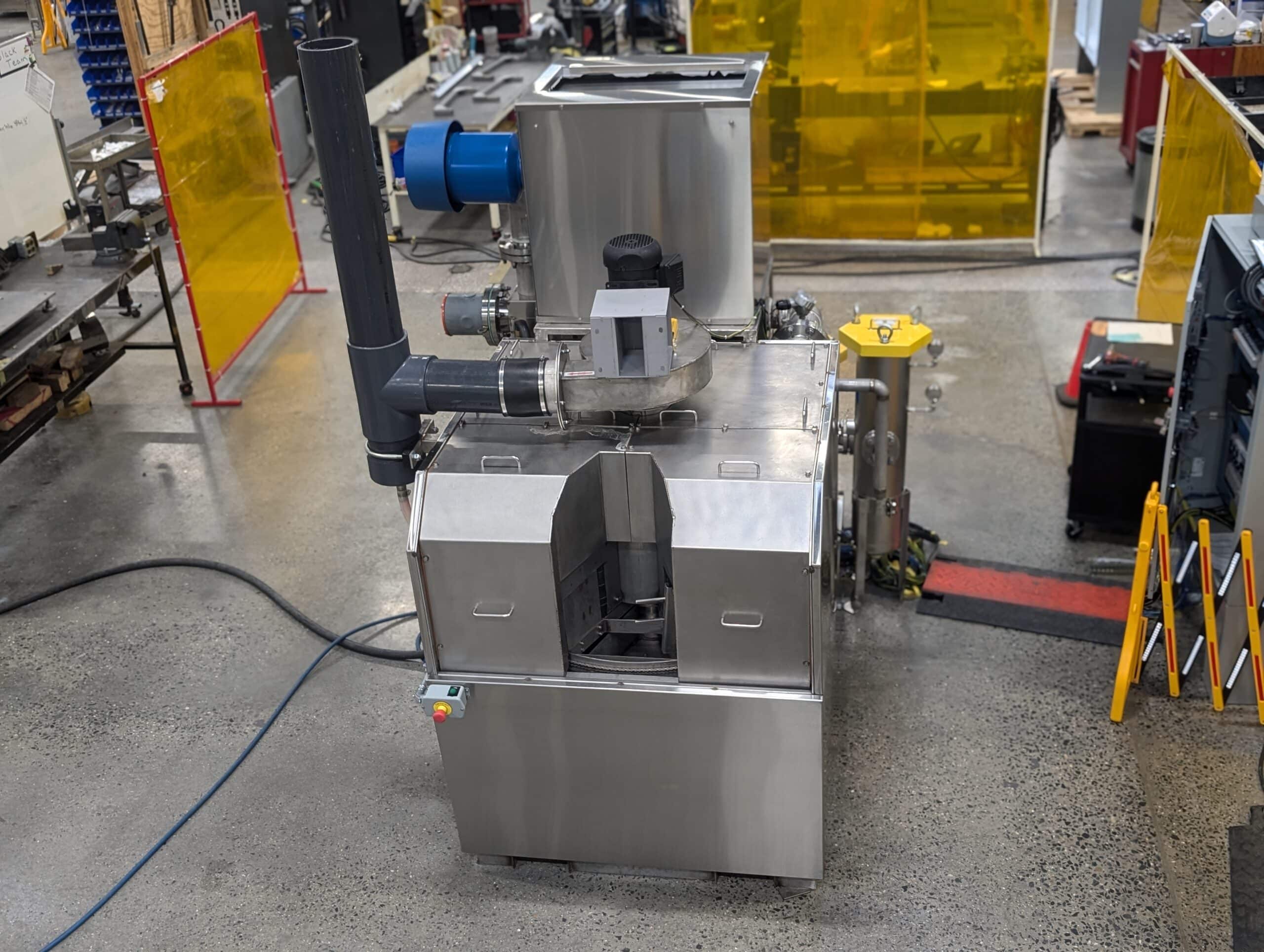 Better Engineering C-4000 Automotive Carousel Part Washer. Designed with custom fixtures to fit automotive parts.