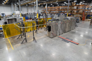 Better Engineering Monorail Part Washer designed to clean automotive parts.