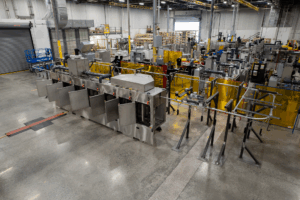 Better Engineering stainless steel monorail conveyor part washer for cleaning automotive parts.