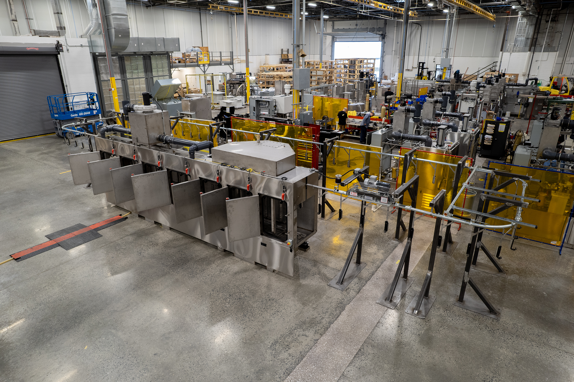 Better Engineering stainless steel monorail conveyor part washer for cleaning automotive parts.