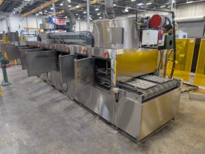 Better Engineering stainless steel C-48 sanitizing tunnel tote washer. Designed for the food processing industry to meet compliance.