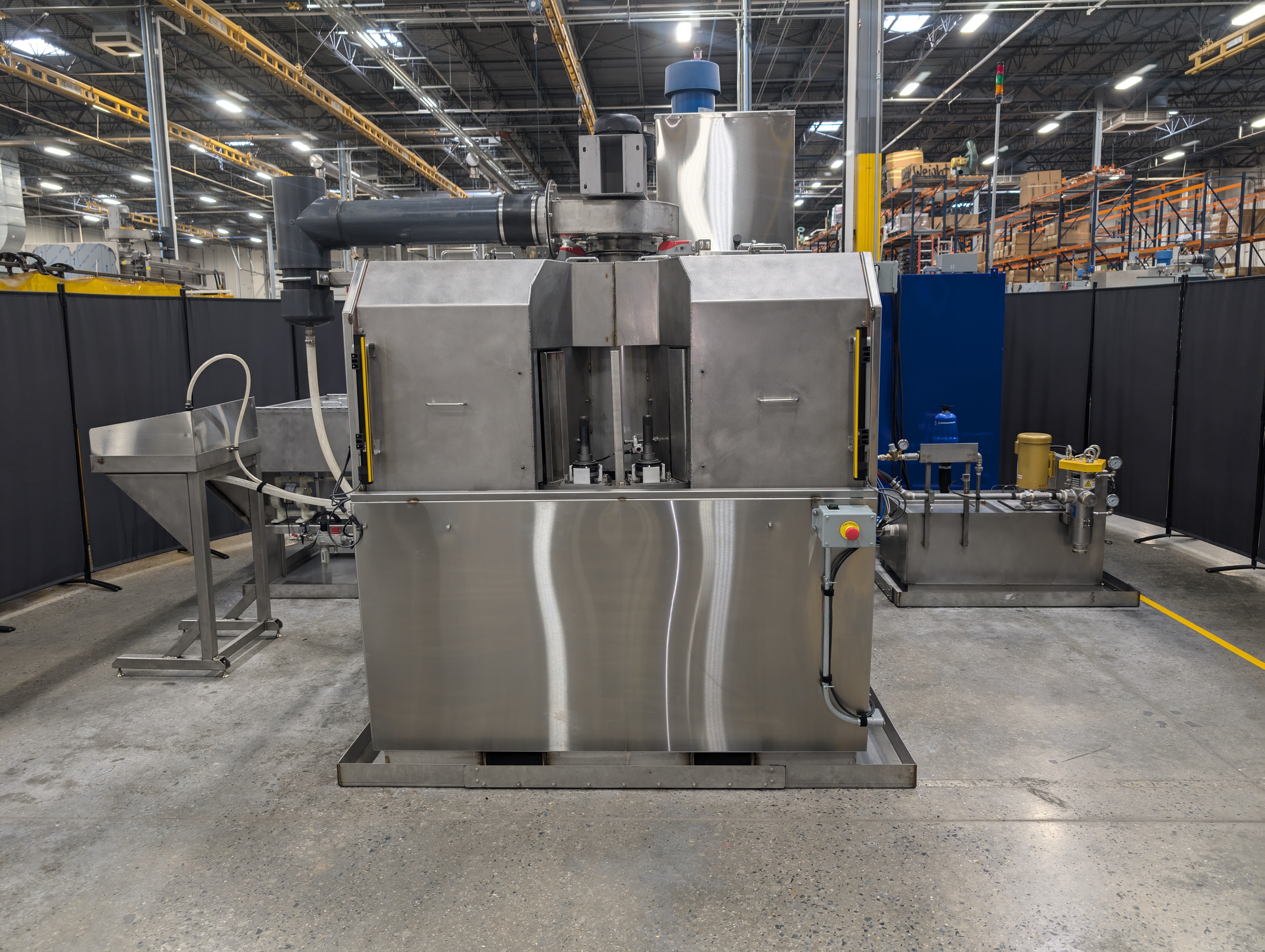 Better Engineering automotive carousel washer designed to clean stub axle components.