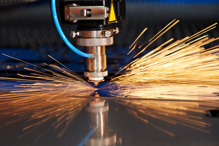 Close-up of laser cutting machine being used to cut sheet metal.