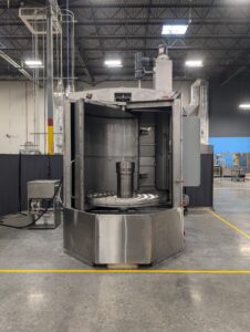 Heavy-duty cabinet part washer designed to clean rail and transit components.