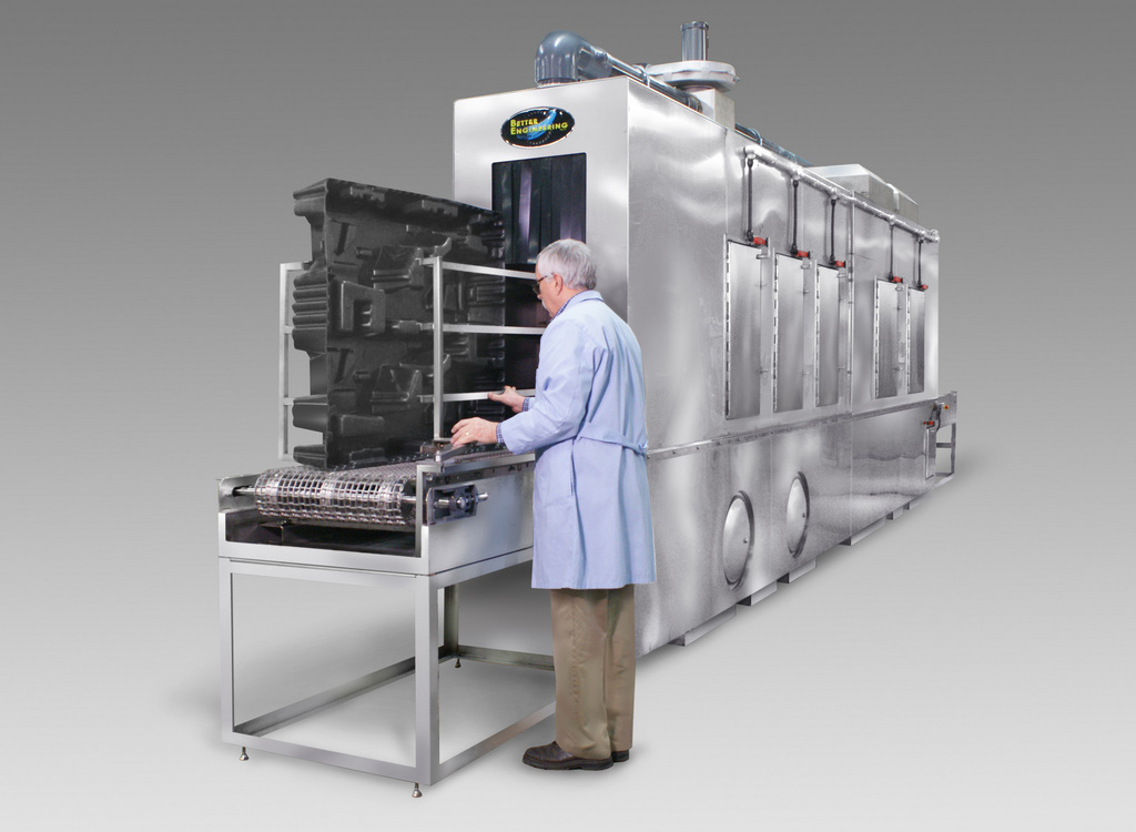 C-24-SS/ DH Conveyor Washer designed to clean plastic totes and bins of various sizes.