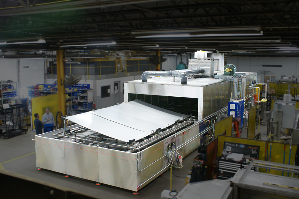 Conveyor Parts Washer designed to clean rocket panels.
