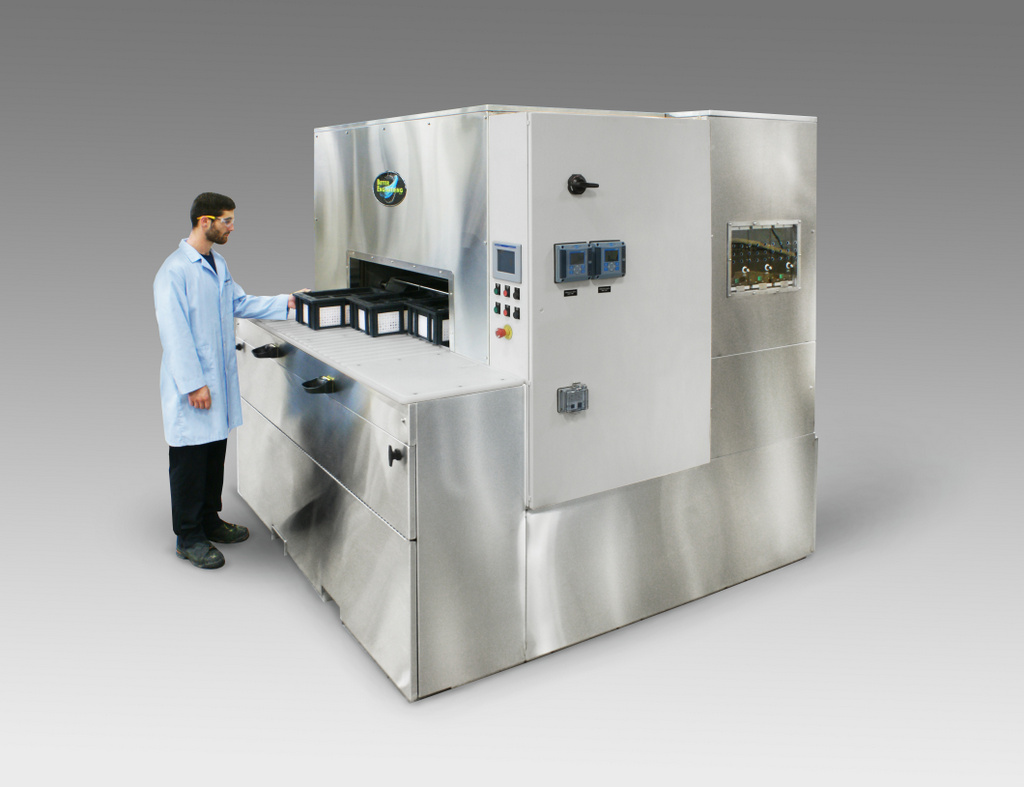 Rotary Drum Washer designed for cleaning intricate plates that had been laser drilled.