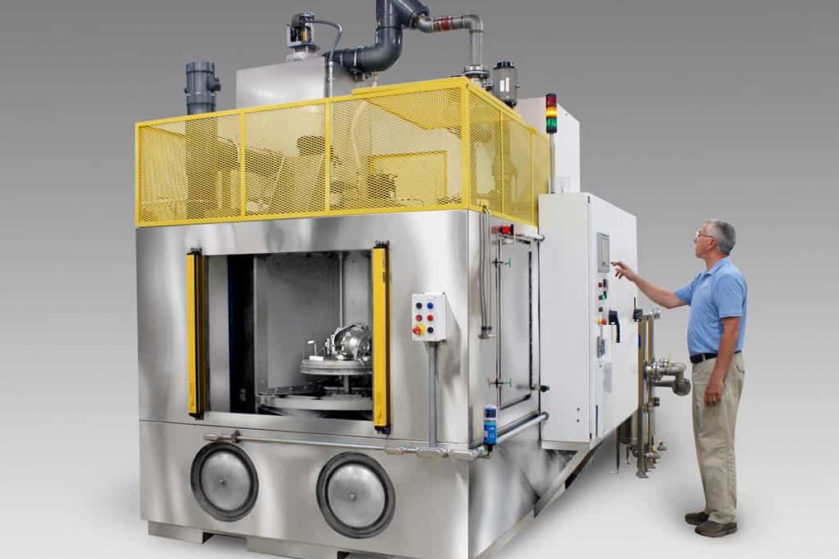 Carousel washer to clean automotive driveline and drivetrain parts