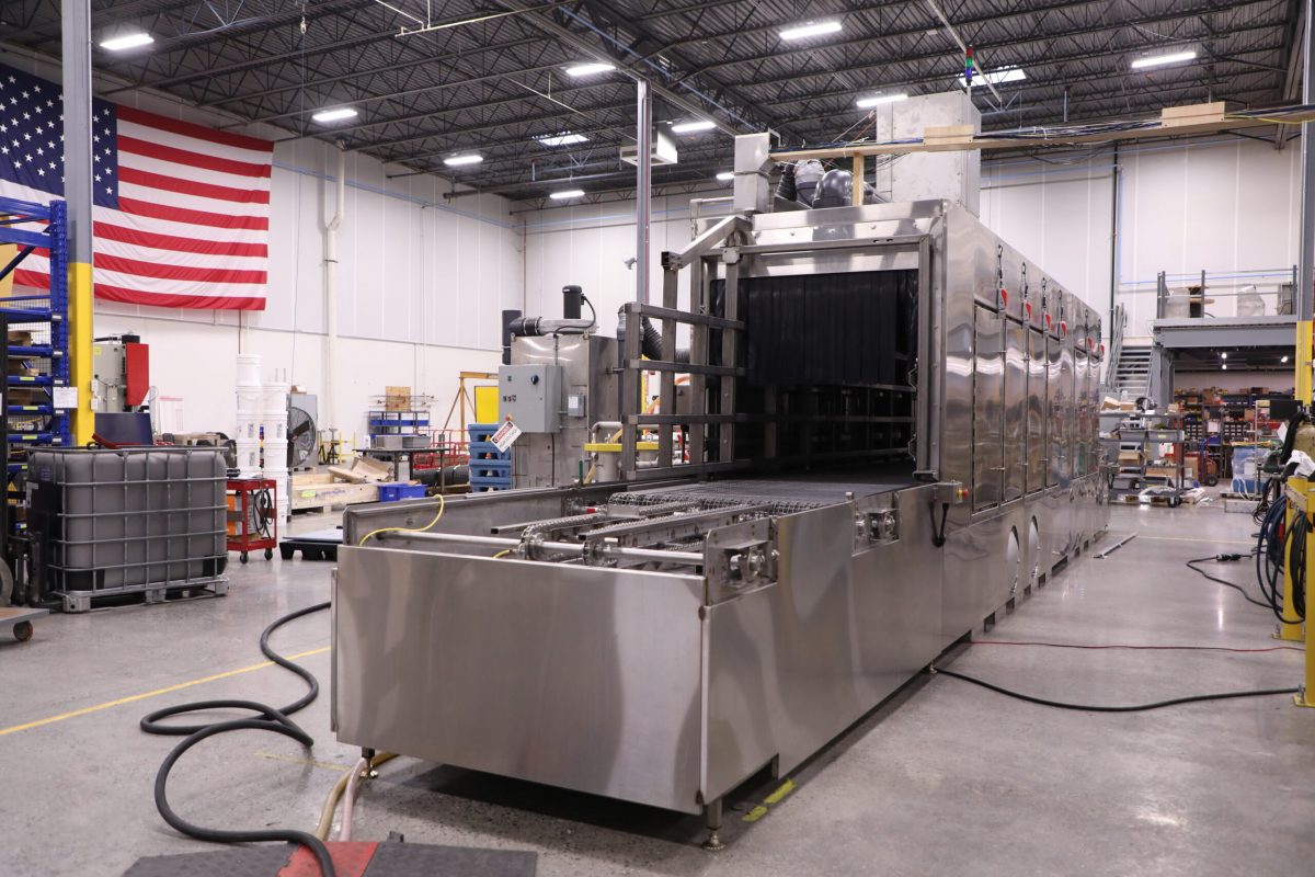 Better Engineering stainless steel conveyor tote washer system.