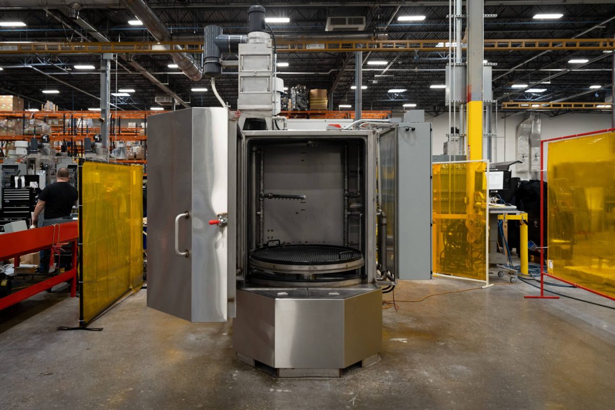 Stainless steel spray cabinet part washer for cleaning filling components.