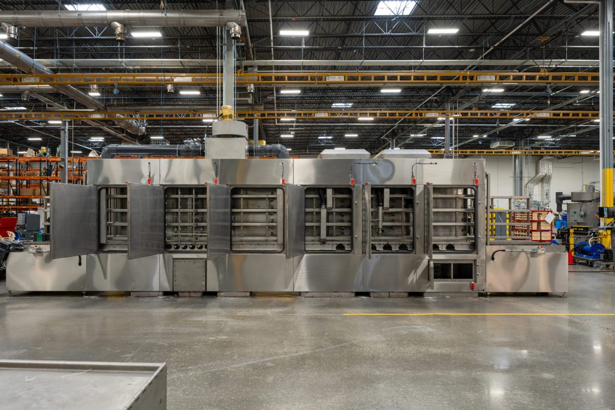 Better Engineering stainless steel conveyor tote washer system.