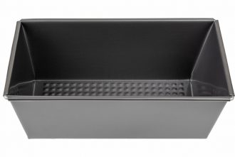 Non-stick loaf pan cutout. Empty baking tray isolated on a white background. Rectangular bread pan for oven. Baking dish concept. Metal mold for homebaked bread, cake, pate, casserole. Non-stick loaf pan cutout. Empty baking tray isolated on a white background. Rectangular bread pan for oven. Baking dish concept. Metal mold for homebaked bread, cake, pate, casserole.